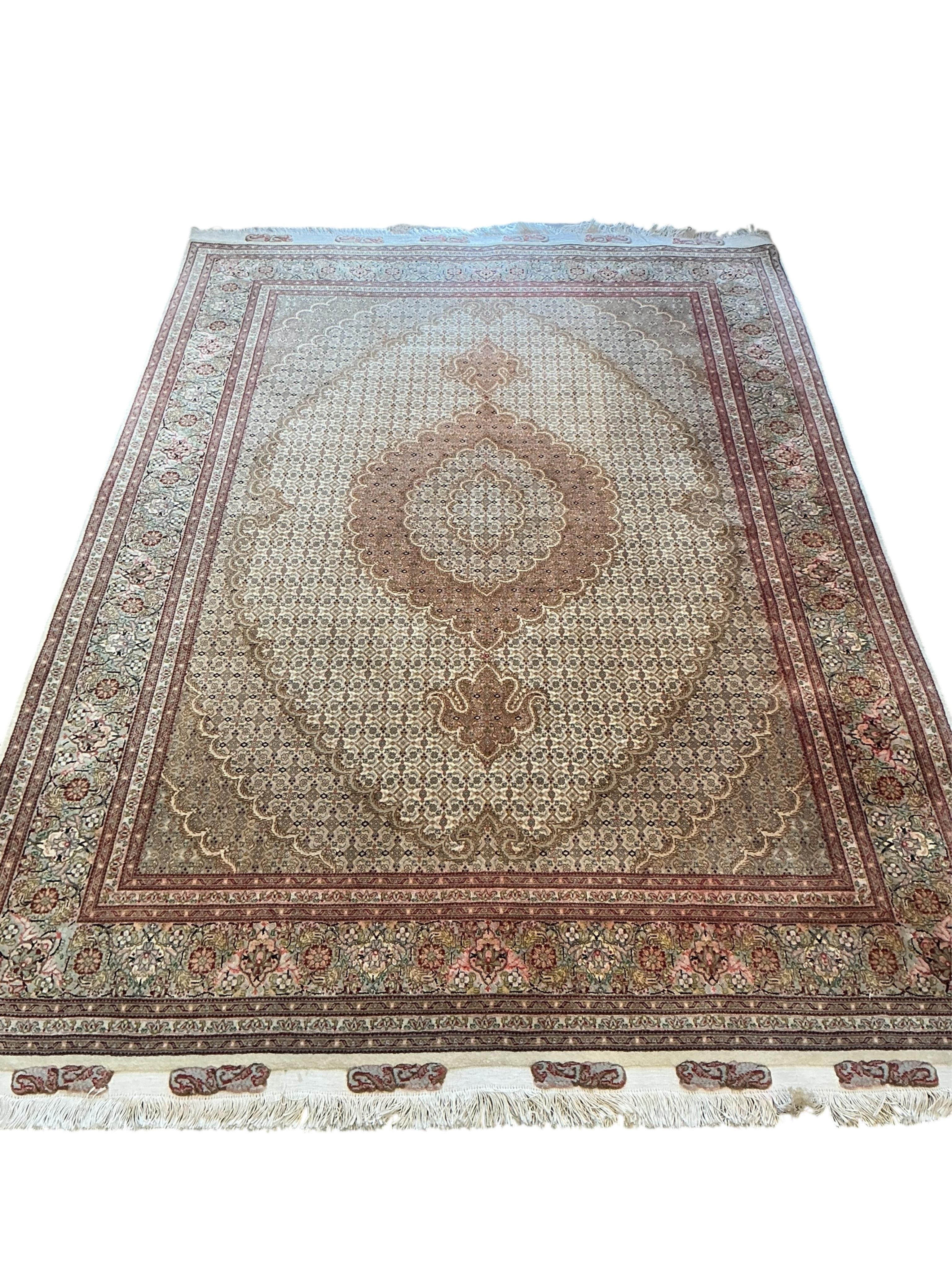 A North West Persian ivory ground rug, 245 x 170cm